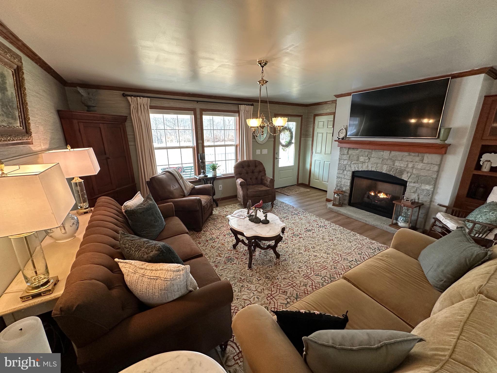 3402 Elk Lick Road Everett, PA 15537 - Photo 6 of 80 a living room with furniture fireplace and a flat screen tv