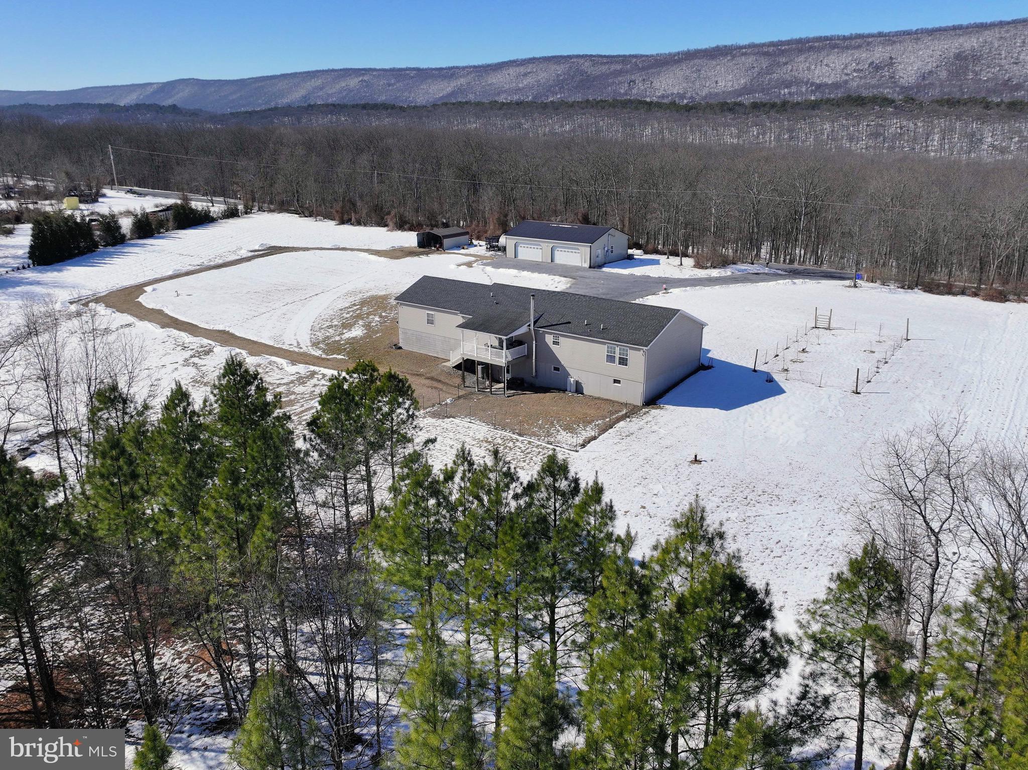 3402 Elk Lick Road Everett, PA 15537 - Photo 65 of 80 a view of a lake with couches and city view