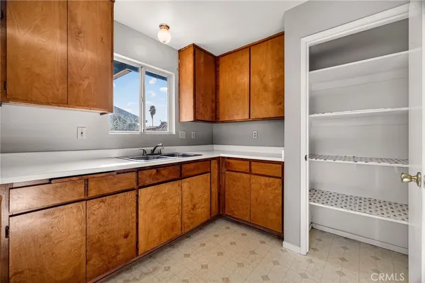 a kitchen with stainless steel appliances granite countertop a sink and a cabinets