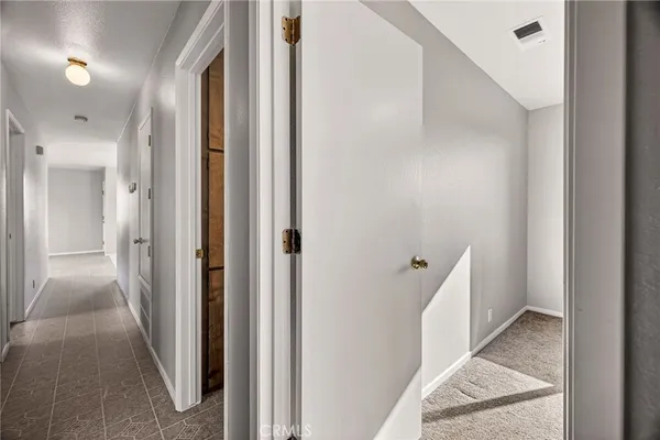 a view of a hallway with a white door