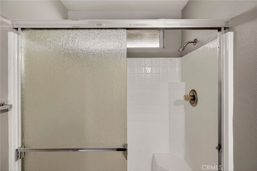 2883 5th Street Biggs, CA 95917 - Photo 24 of 38 a bathroom with a shower