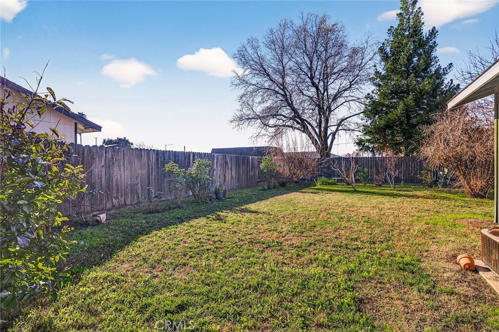 2883 5th Street Biggs, CA 95917 - Photo 32 of 38 a view of backyard with wooden fence