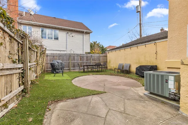 a view of a house with a backyard and porch