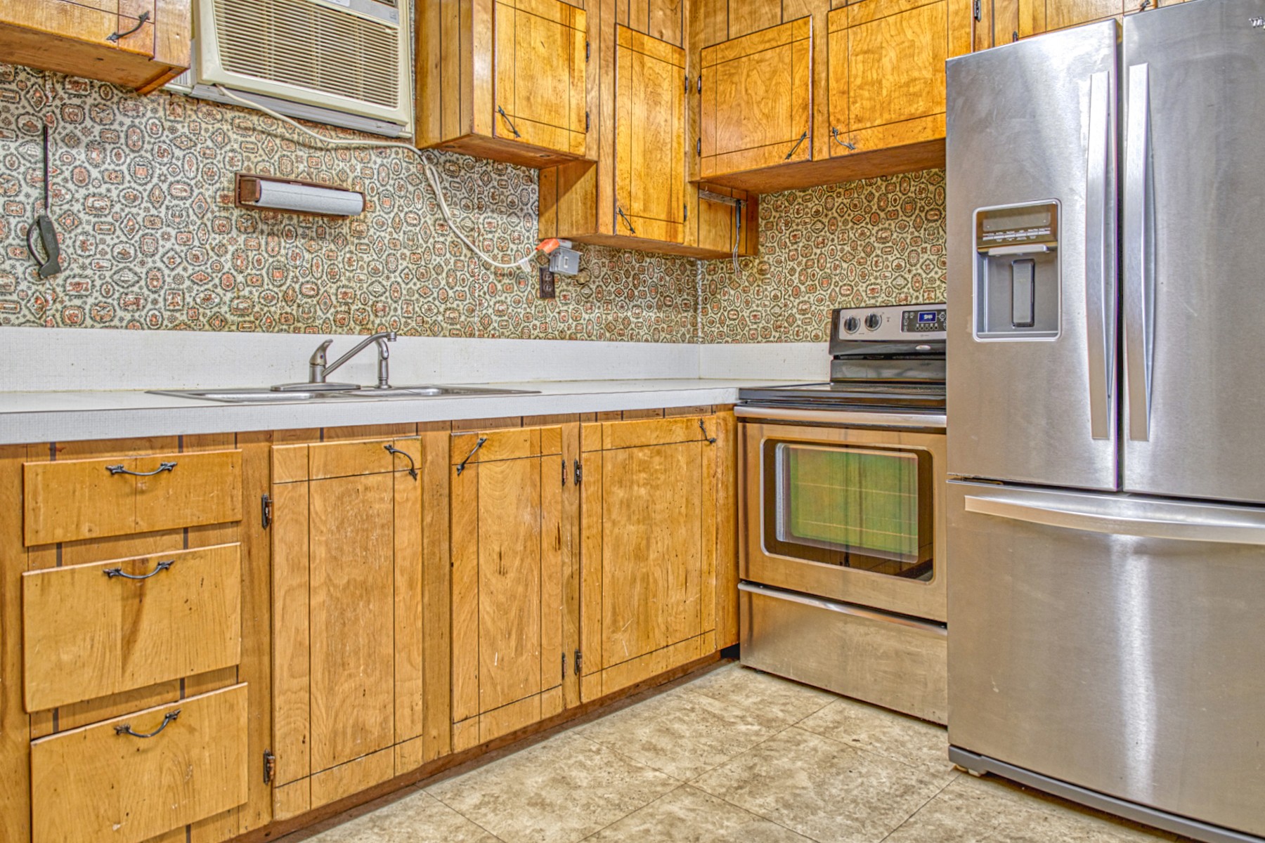 9349 Old Baxter Road Baxter, TN 38544 - Photo 14 of 25 a kitchen with stainless steel appliances granite countertop white cabinets and a refrigerator
