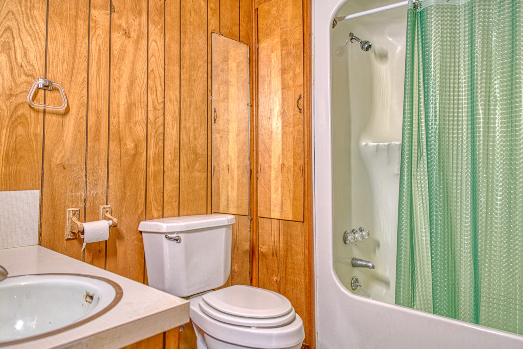 9349 Old Baxter Road Baxter, TN 38544 - Photo 23 of 25 a bathroom with a sink a toilet and shower curtain