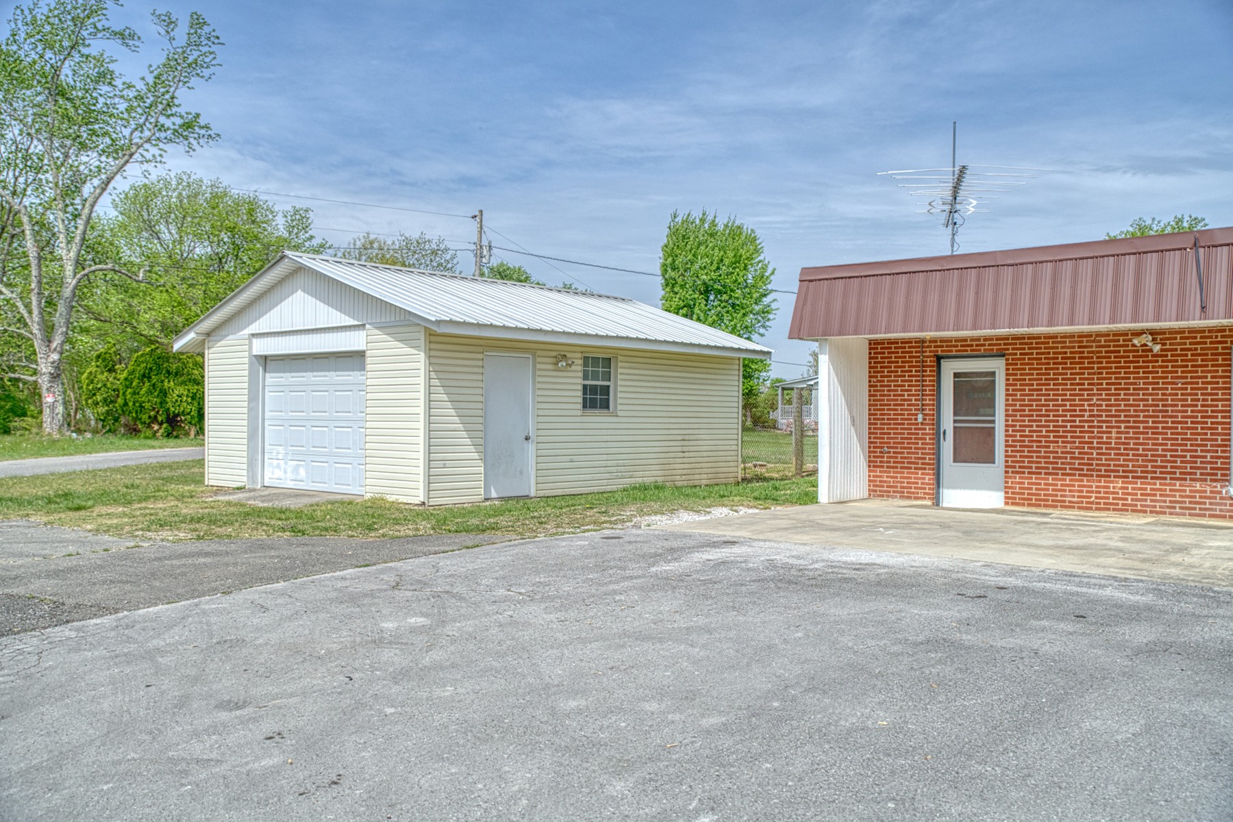 9349 Old Baxter Road Baxter, TN 38544 - Photo 25 of 25 a front view of a house with a yard and garage