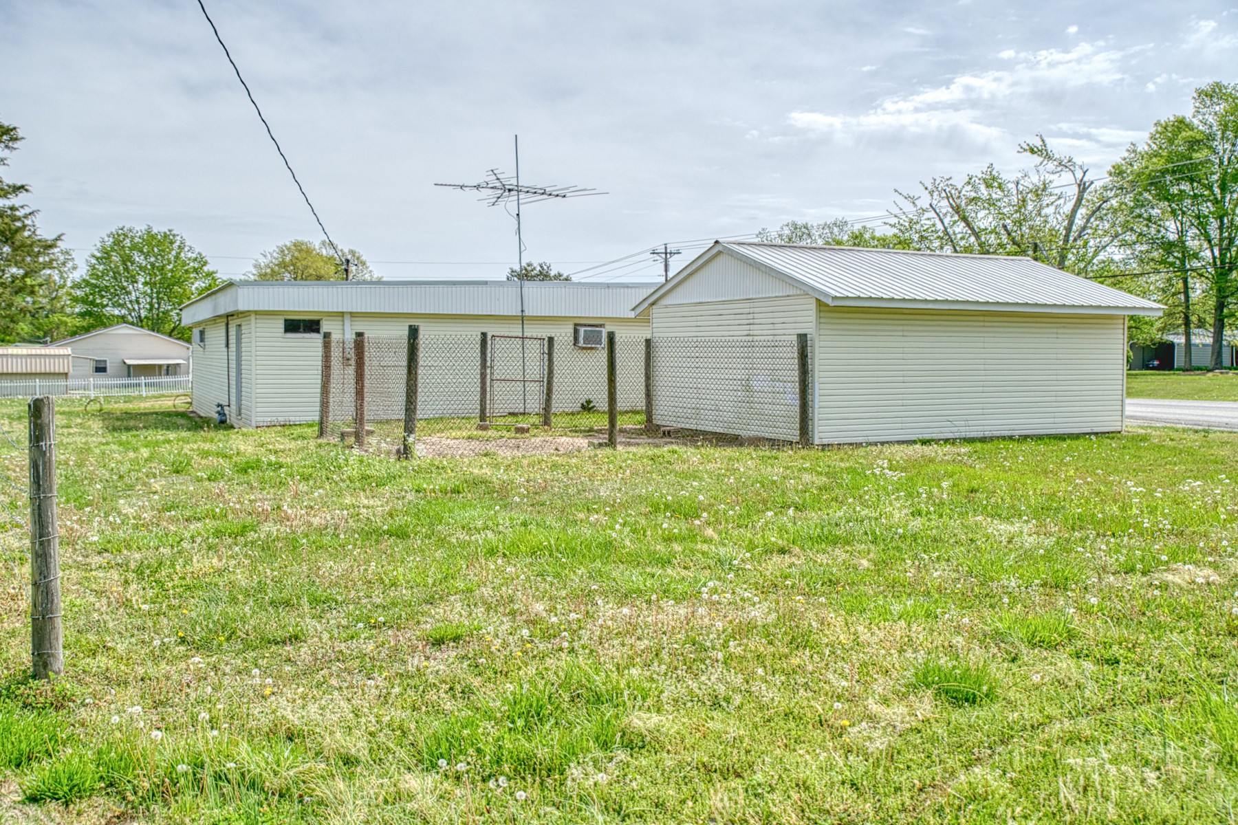 9349 Old Baxter Road Baxter, TN 38544 - Photo 10 of 25 a front view of house with yard and trees in the background