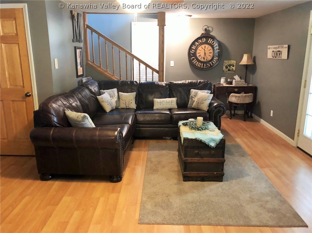 5086 Five Mile Road Gallipolis Ferry, WV 25515 - Photo 11 of 29 Living Room w/Storage Sun Room area off to the Right