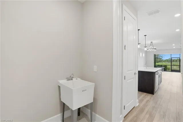 a view of bathroom with dual sinks