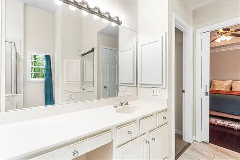 a bathroom with a sink and a mirror