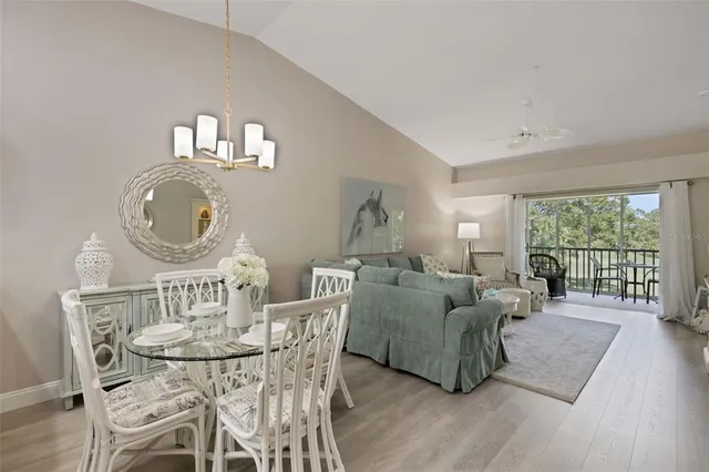 a view of a balcony with a table and chairs