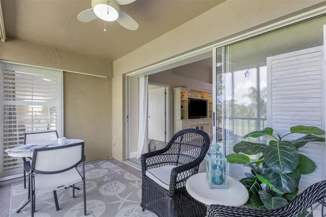 a bedroom with two beds and a large window