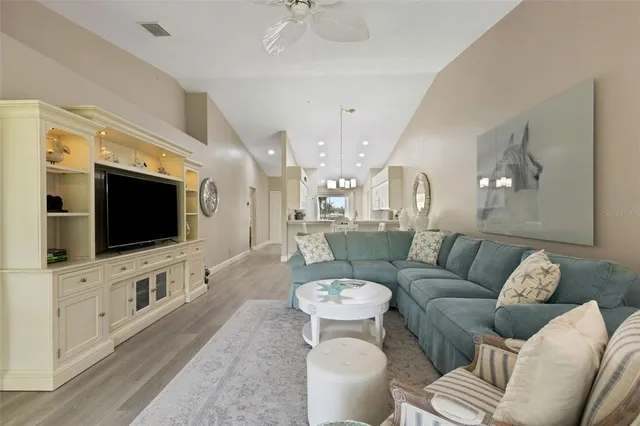 a bedroom with two beds and painting on the wall