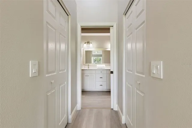 an aerial view of a house with a garden and lake view