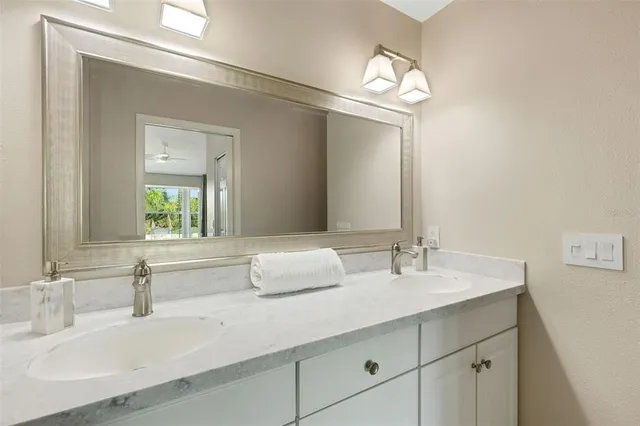 an aerial view of a house with a garden and lake view