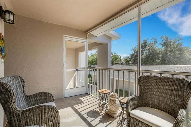 an aerial view of lake residential houses with outdoor space and trees