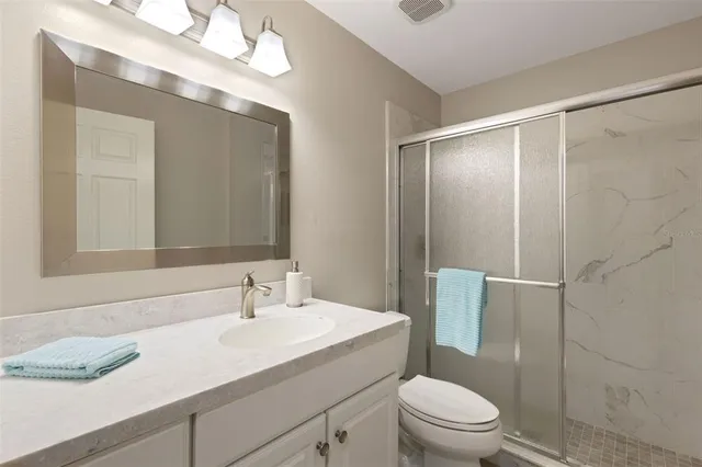 an aerial view of a house with a ocean view