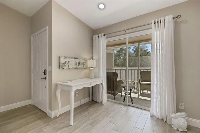 a kitchen with stainless steel appliances granite countertop a sink a stove and a granite counter tops with white cabinets