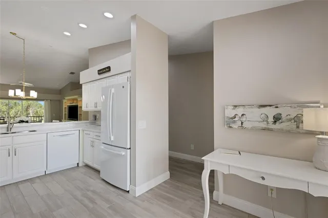 a living room with furniture a fireplace and a large mirror