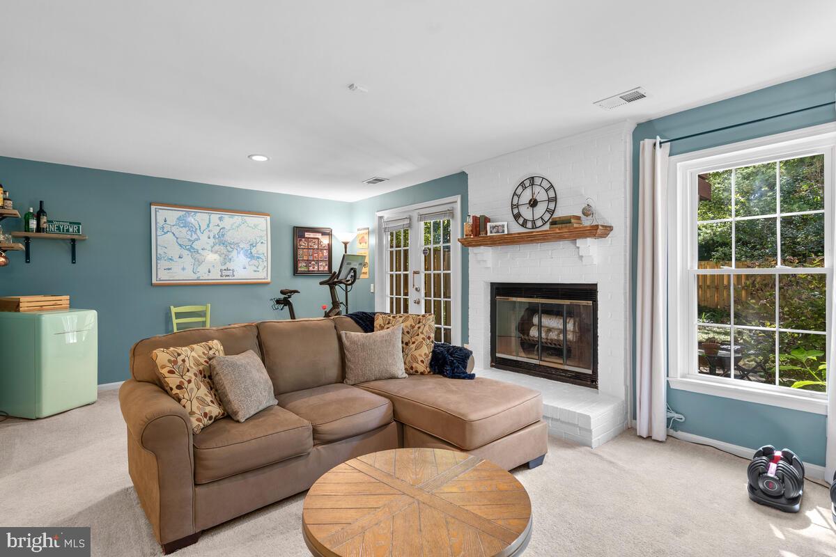 609 Sonata Way Silver Spring, MD 20901 - Photo 32 of 47 Family room with wood burning fireplace