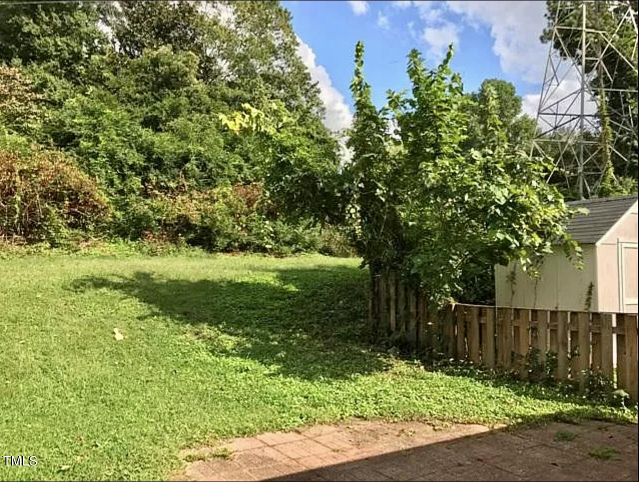 916 Dixie Trail Raleigh, NC 27607 - Photo 17 of 22 a view of a garden with a tree