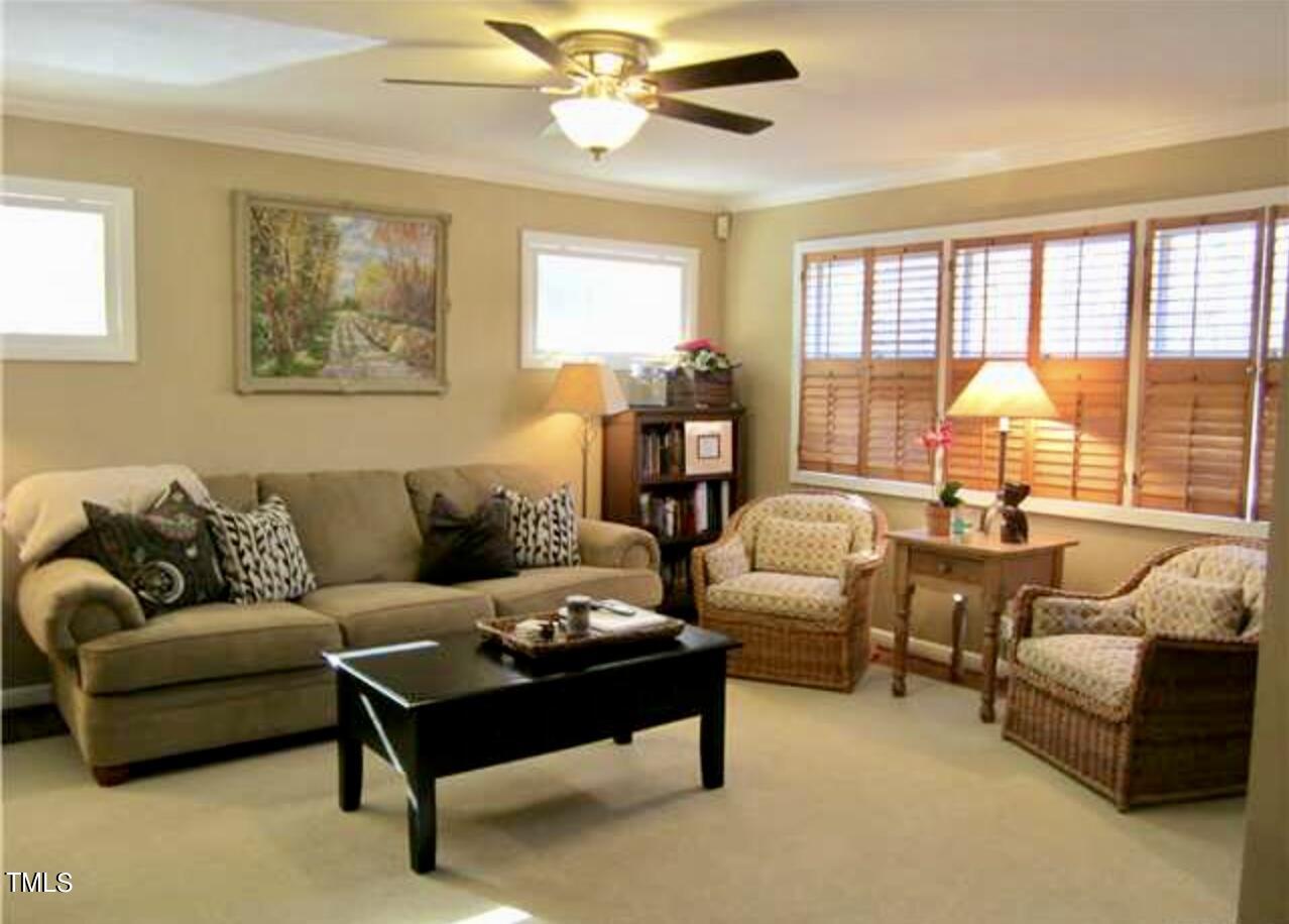 916 Dixie Trail Raleigh, NC 27607 - Photo 5 of 22 a living room with furniture and a large window