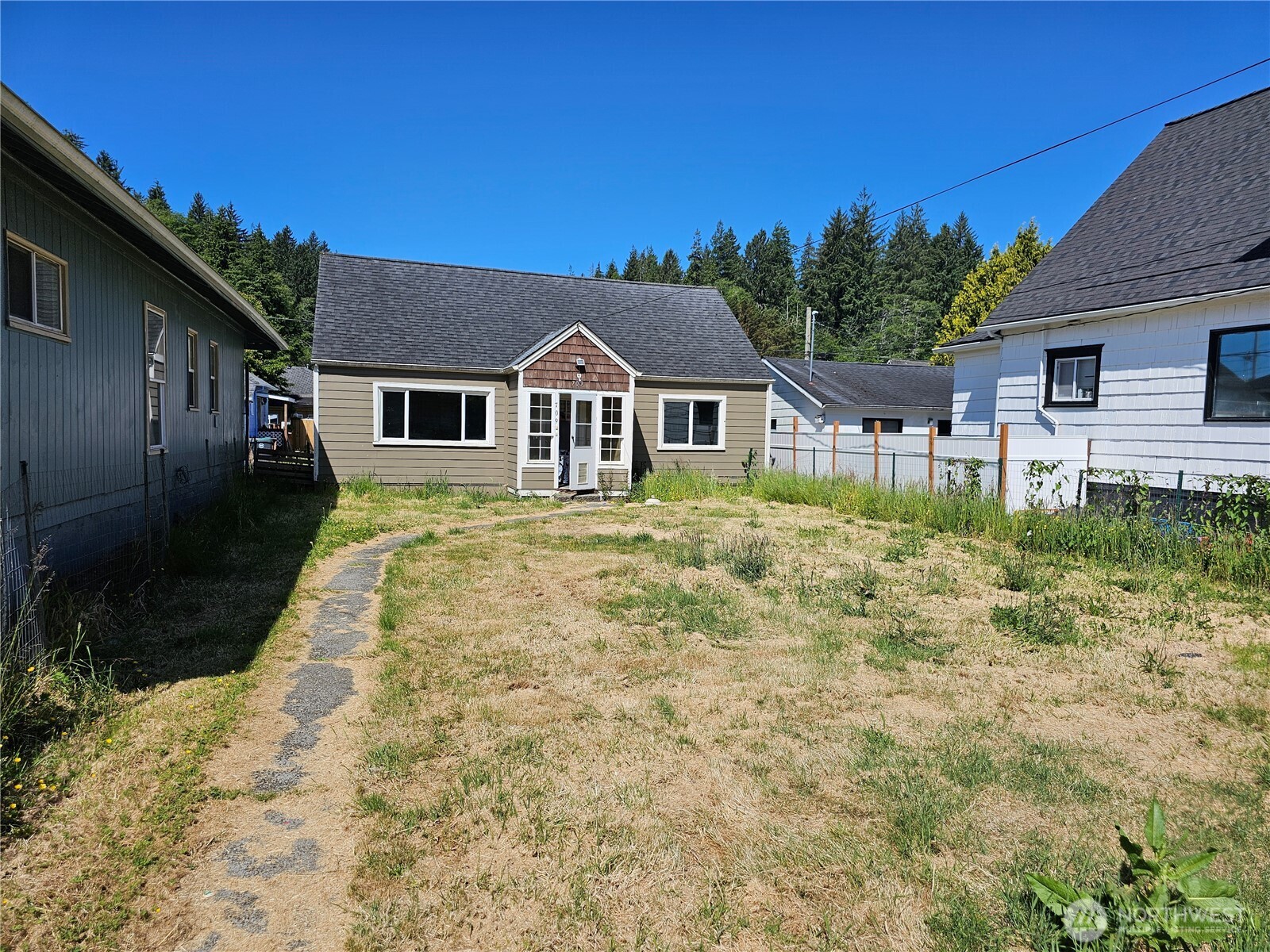 a house with trees in the background