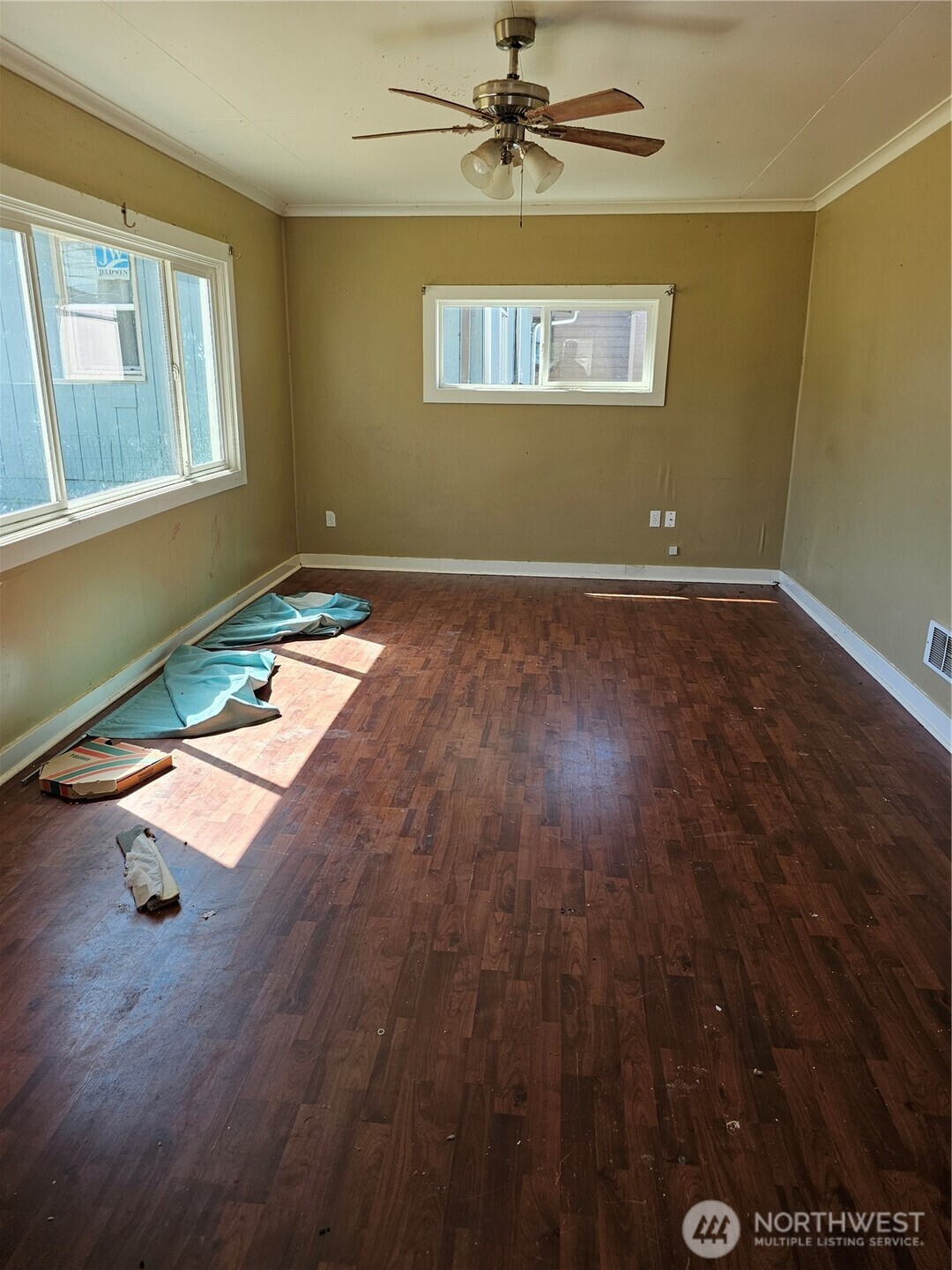 709 Monroe Street Hoquiam, WA 98550 - Photo 5 of 22 a view of a room with wooden floor and windows