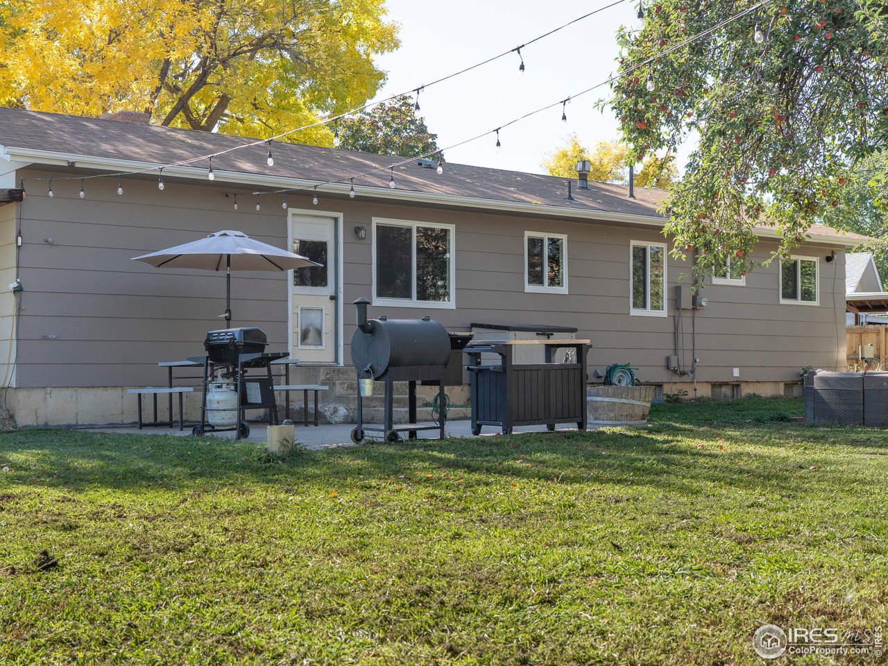 1101 20th Street Southwest Loveland, CO 80537 - Photo 18 of 24 a view of a chair and table in backyard of the house