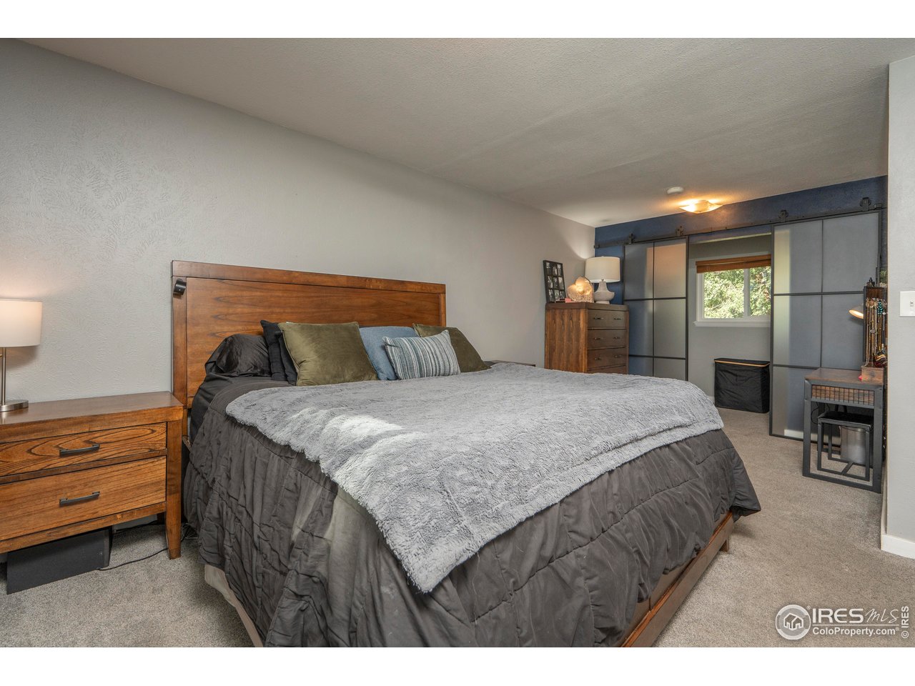 1101 20th Street Southwest Loveland, CO 80537 - Photo 9 of 24 a bedroom with a bed and window