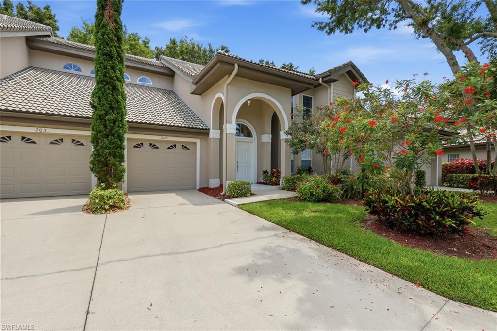 203 Via Perignon, Unit 24 Naples, FL 34119 - Photo 42 of 42 Driveway can accommodate 2 cars additional parking across the street next to the pool