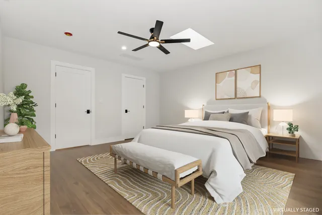 a bedroom with a bed and window