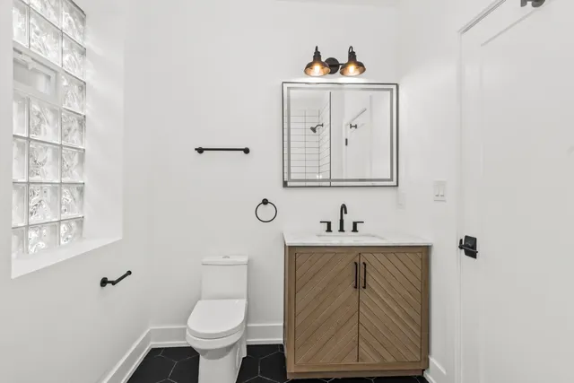 a view of an entryway with wooden floor and a window