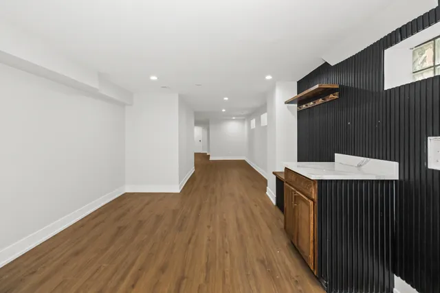 a view of a kitchen with wooden floor