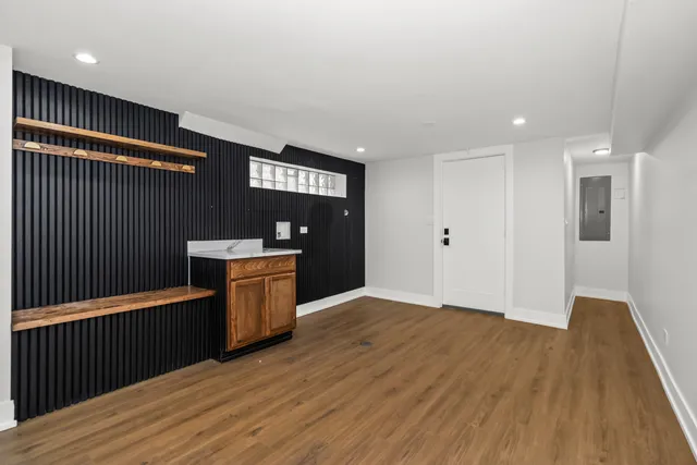 a view of a room with wooden floor