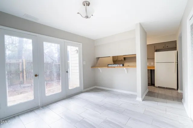 a view of empty room with front door