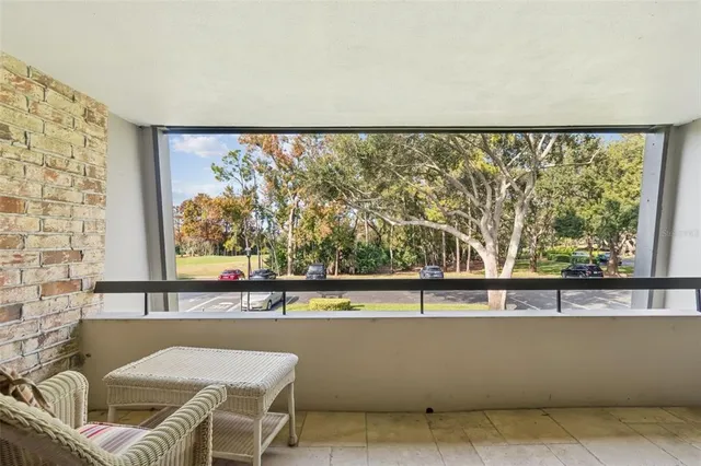 a bedroom with a bed and a chair