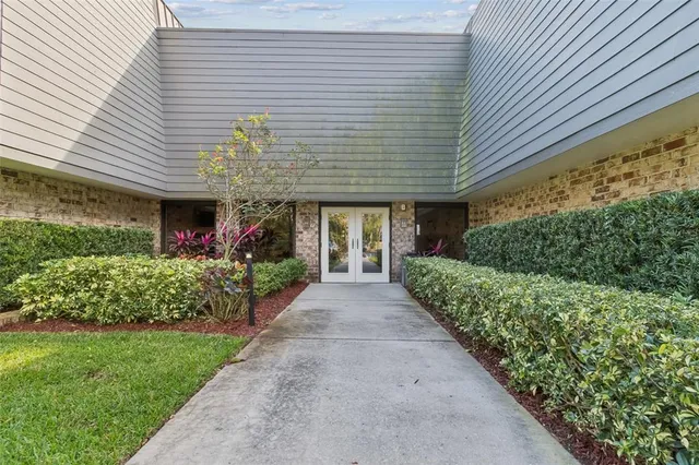 a kitchen with stainless steel appliances granite countertop sink stove and refrigerator