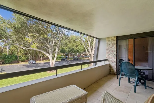 a bedroom with a bed and a lamp with window