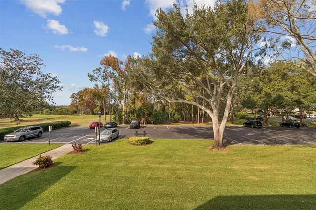 a spacious bathroom with a granite countertop sink and a mirror