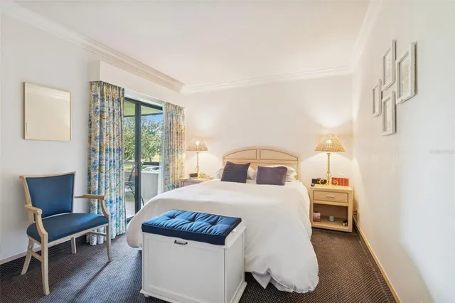 a bedroom with two beds and lamp