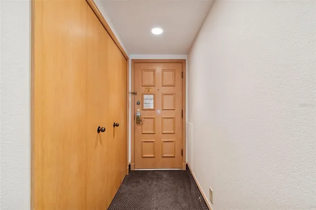 a view of a backyard with sitting area and garden