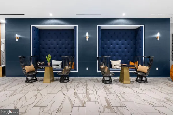 a living room with fireplace furniture and a large window