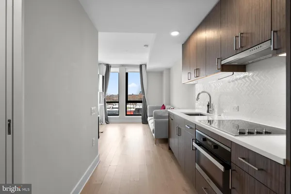 a living room with furniture and large window