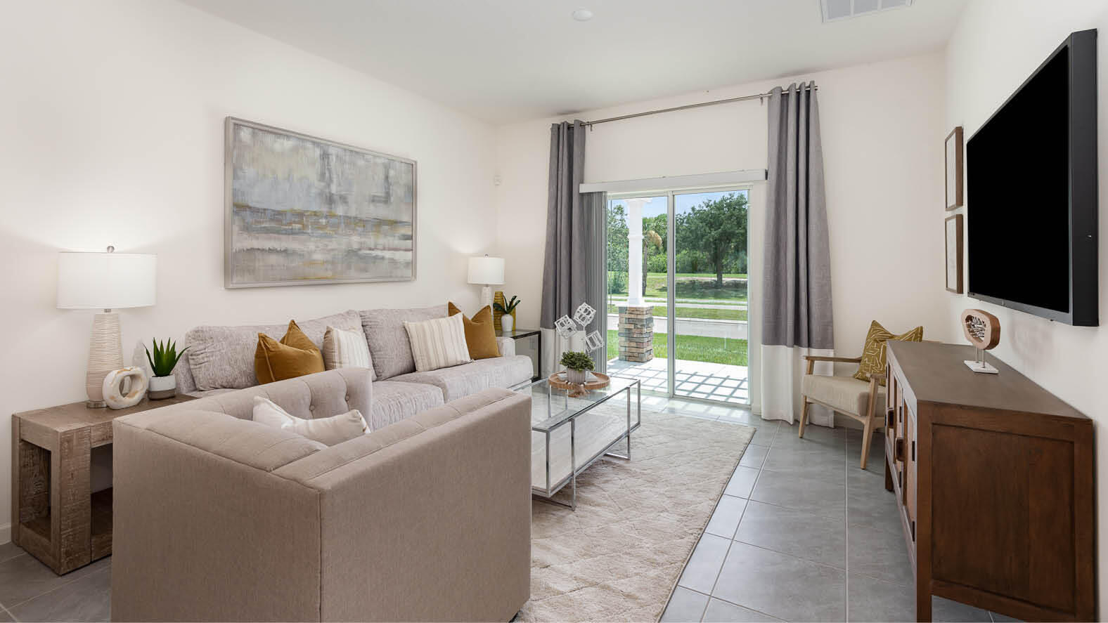 3326 Morrow Place Mims, FL 32754 - Photo 5 of 42 a room with a bed and a flat screen tv