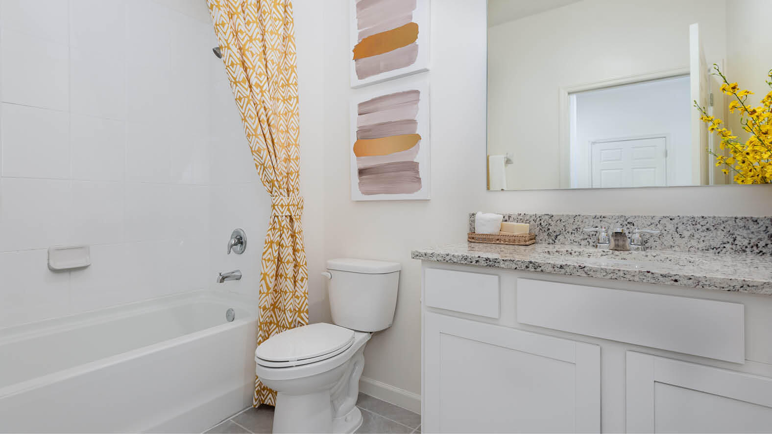 3326 Morrow Place Mims, FL 32754 - Photo 10 of 42 a bathroom with a granite countertop toilet sink and a bathtub