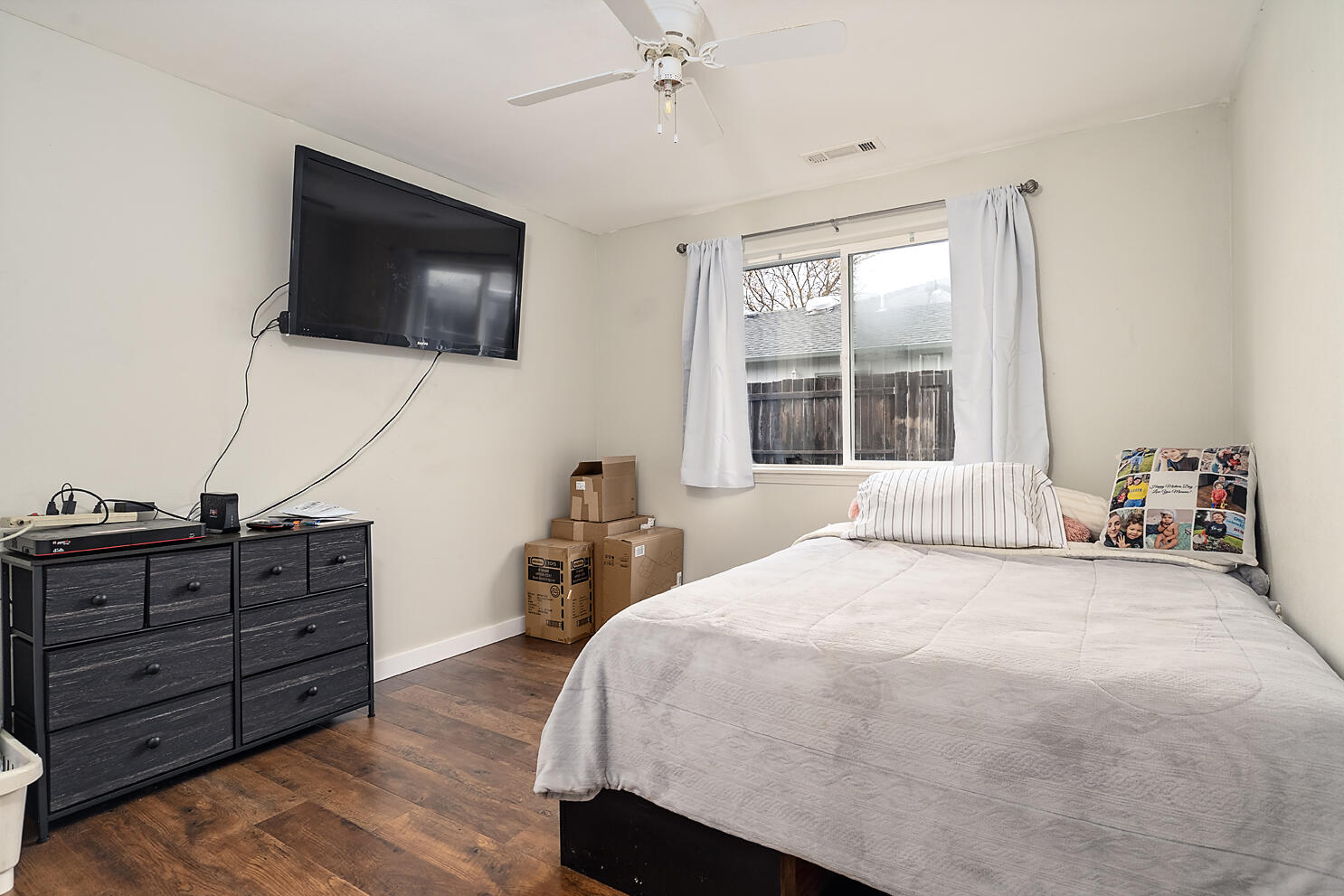 836 Ridgeview Drive Eagle Point, OR 97524 - Photo 12 of 19 a bedroom with a bed and a flat screen tv