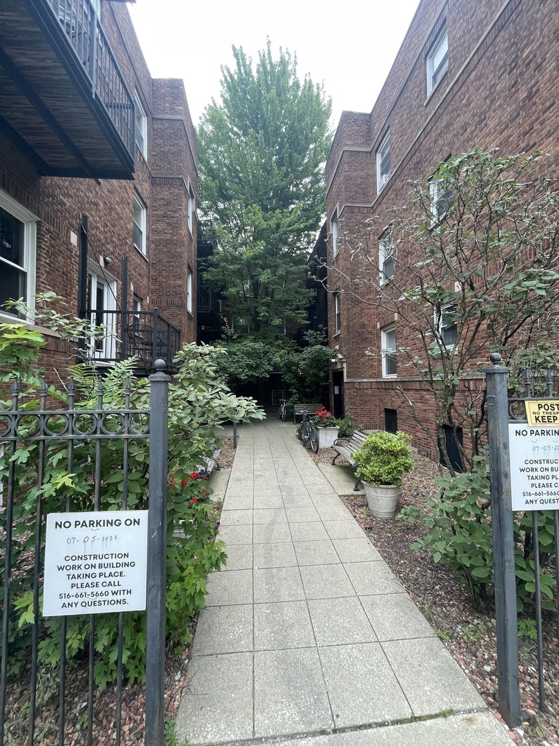 a view of a pathway along a building
