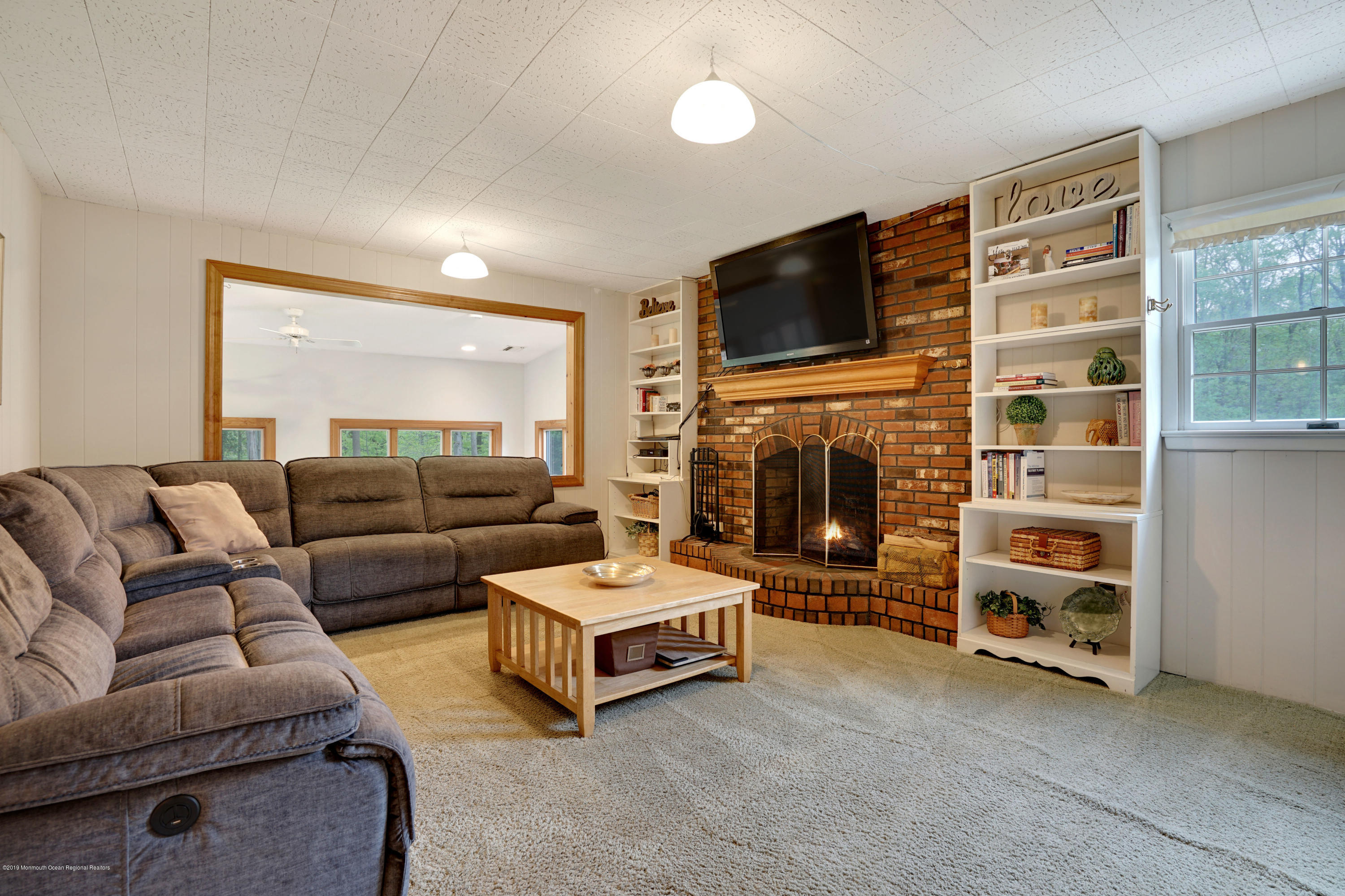 26 Marc Drive Matawan, NJ 07747 - Photo 14 of 30 a living room with furniture and a fireplace