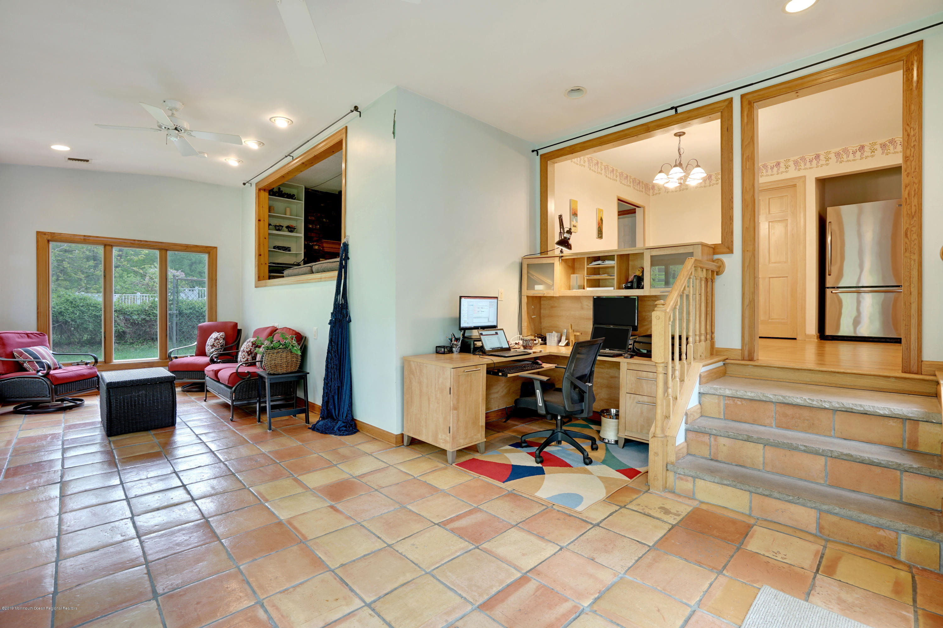 26 Marc Drive Matawan, NJ 07747 - Photo 15 of 30 a view of a workspace with furniture and a livingroom